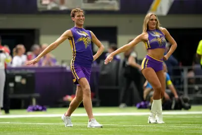 Did cheerleading originate in Minnesota as a male activity?