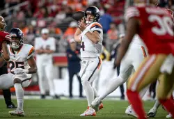 Broncos put DT Malcolm Roach on injured reserve, promote QB Sam Ehlinger