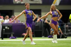 Did cheerleading originate in Minnesota as a male activity?