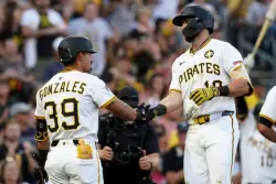 Pirates beat Rockies 5-1 with 2-run home runs from McCutchen and Triolo